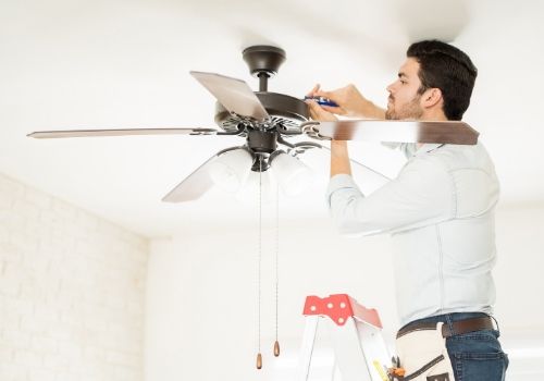 Ceiling Fan Installation - Bathroom exhaust fan installation - Electrician Burlington County NJ Electrician installing ceiling fan photo - Electrician Burlington County NJ