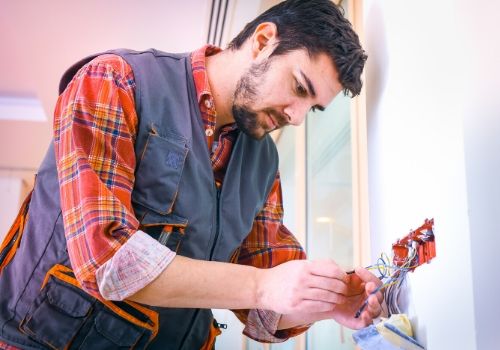 Residential and Commercial Electrical Wiring and Rewiring Services - DK Electrical Solutions Inc. Electrician at work - Wiring and Rewiring services in New Jersey